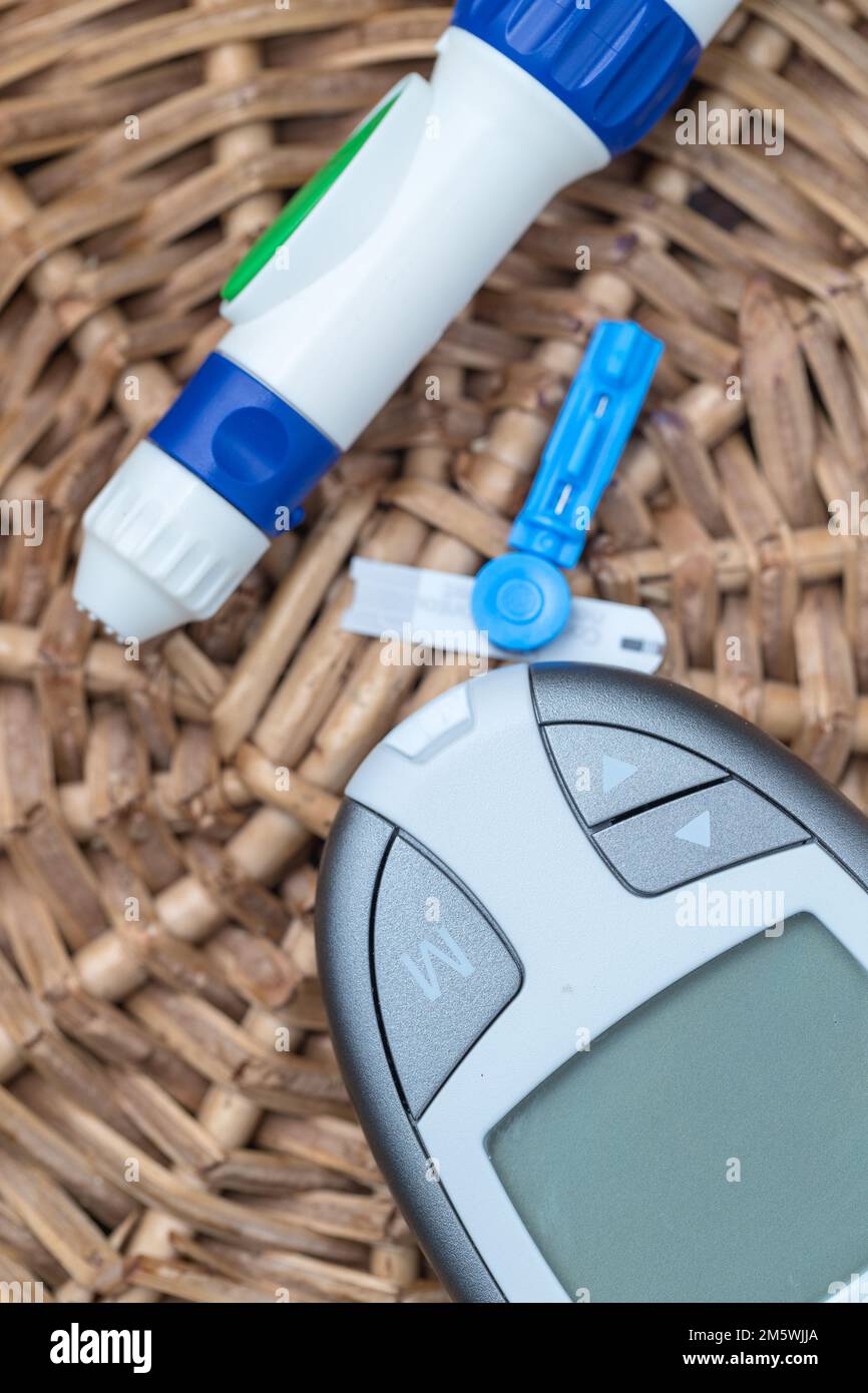 Healthcare and diabetes: Blood glucose meter and testing accessories. Medical concept. Stock Photo