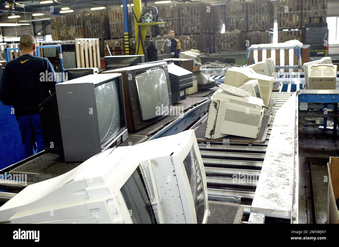 Ewaste. Electronics recycling by sims, dismantling televisions