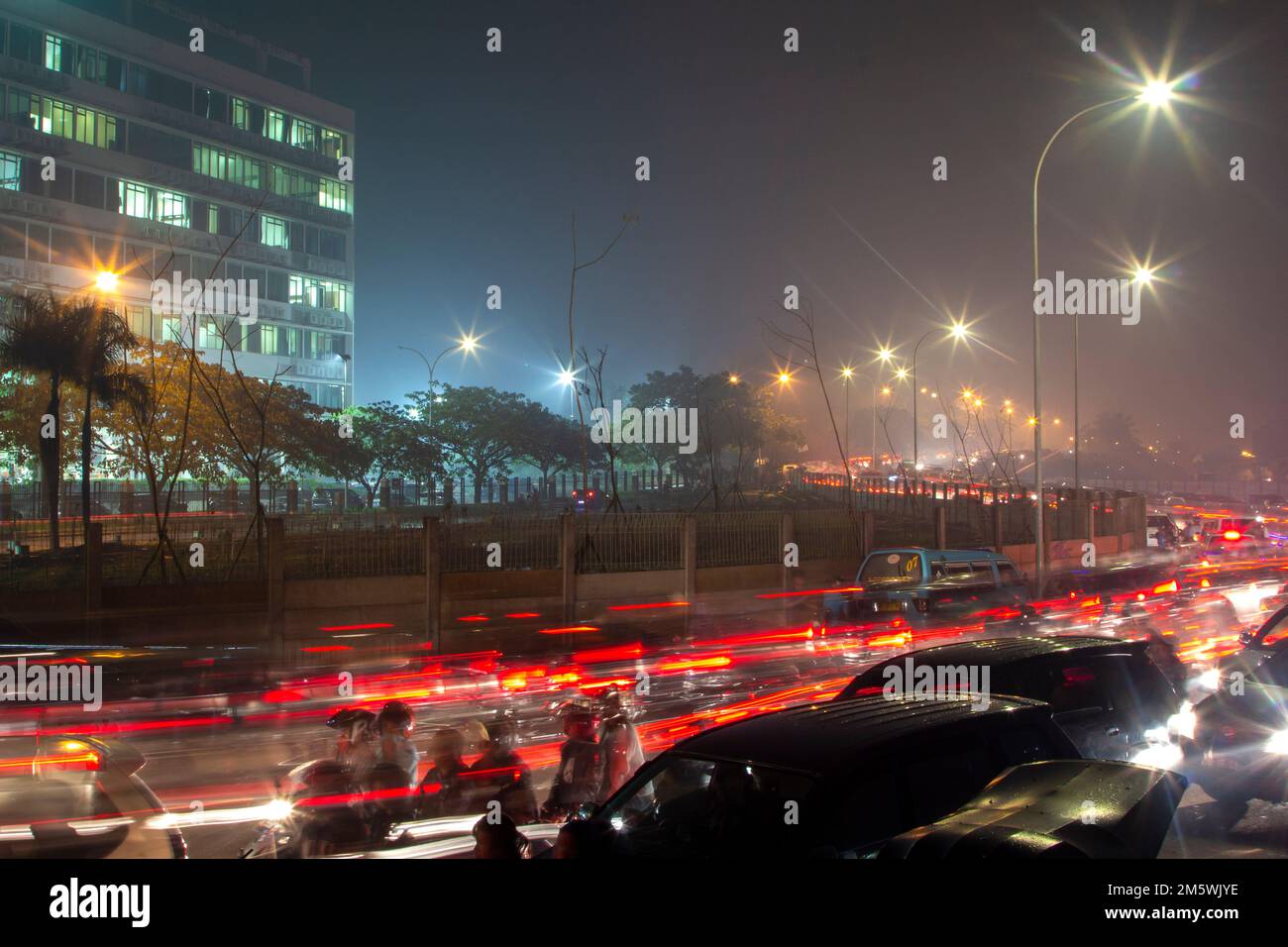 The atmosphere of traffic jams in the city of Makassar around the Losari beach area. Stock Photo