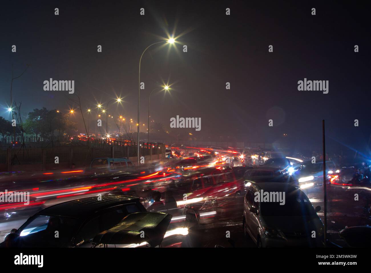 The atmosphere of traffic jams in the city of Makassar around the Losari beach area. Stock Photo