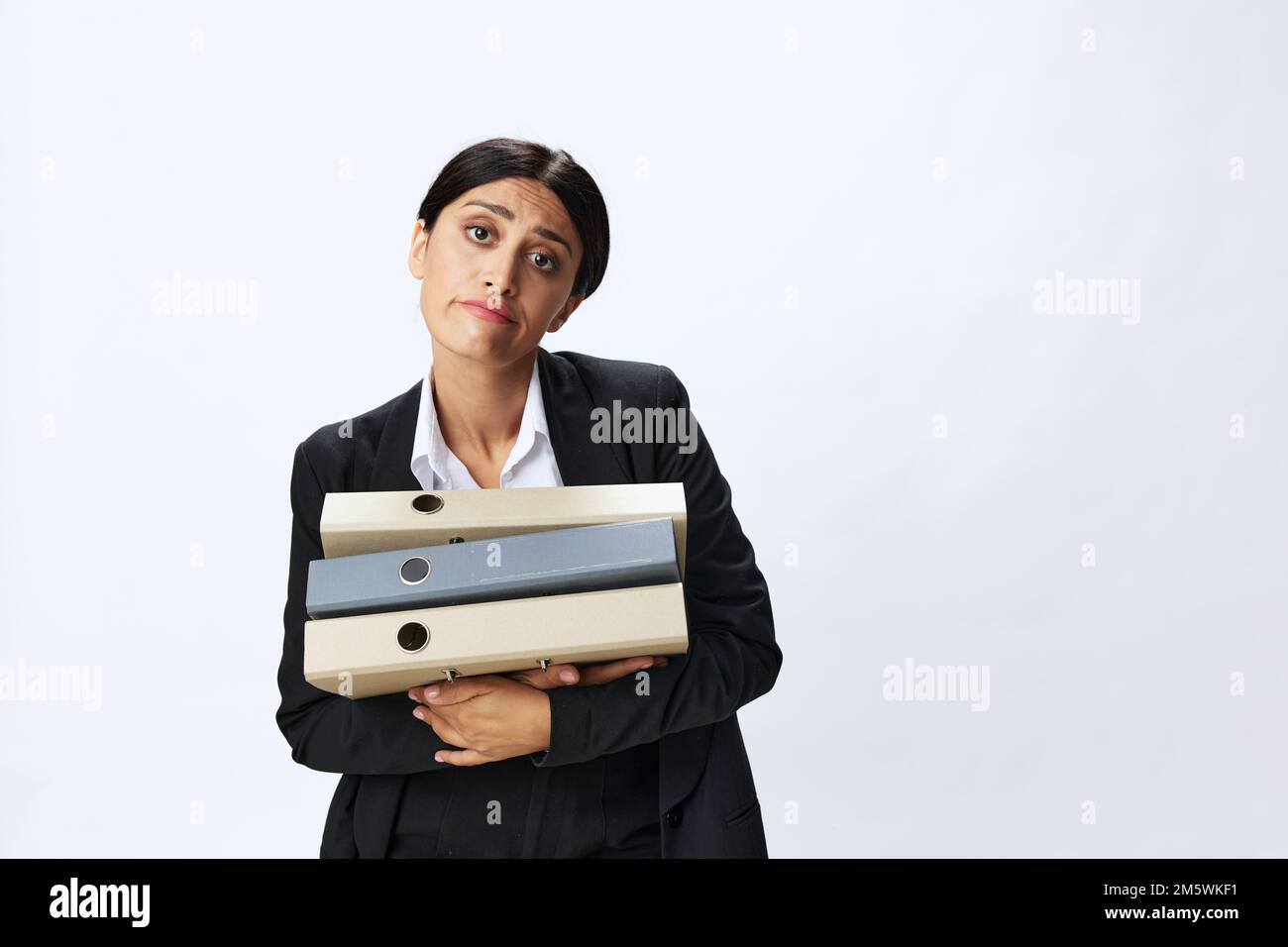 Business woman with a folder of documents in her hands in a black ...