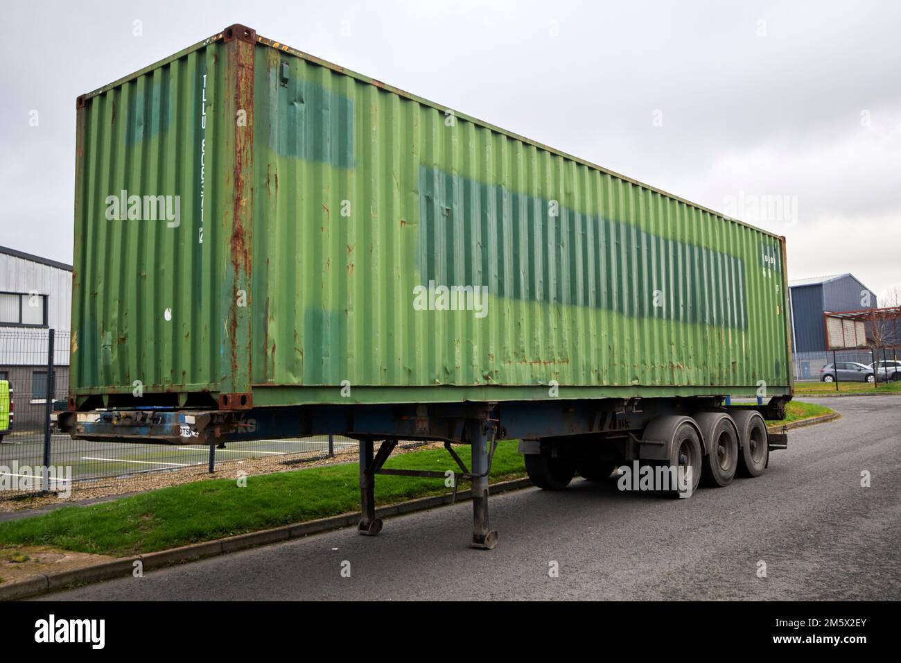 old shipping container on trailer parked or used as temporary storage