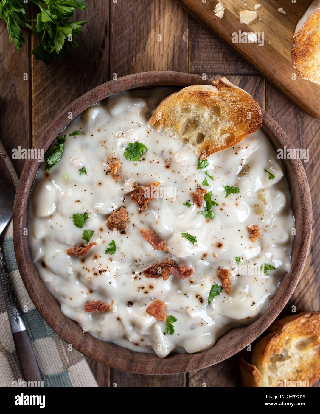 New england clam chowder with bacon, parsley and toasted french bread