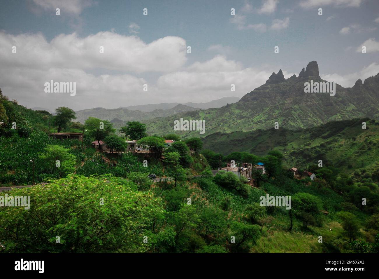 Green plains and mountains with view over the city of Assomada on the island of Santiago, Cabo Verde islands. Stock Photo