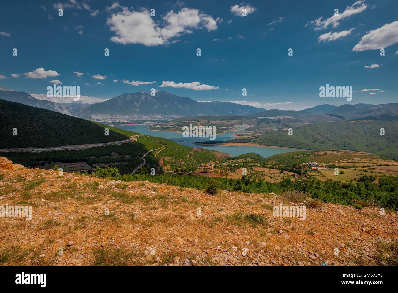 Beautiful panorama of the city of Kukes in northern Albania, summer weather with some clouds over the sky with majestic Sasati and Plinas Stiqen mount Stock Photo