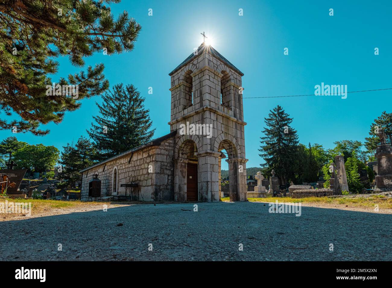 Church close to Orthodox temple of St. Basil of Ostrog in the centre of Niksic, close to cemetery on a sunny day. Stock Photo
