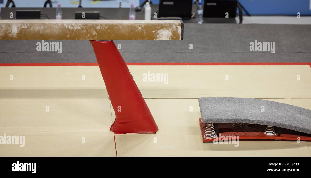 Detail of a balance beam for gymnastics with box spring visible and