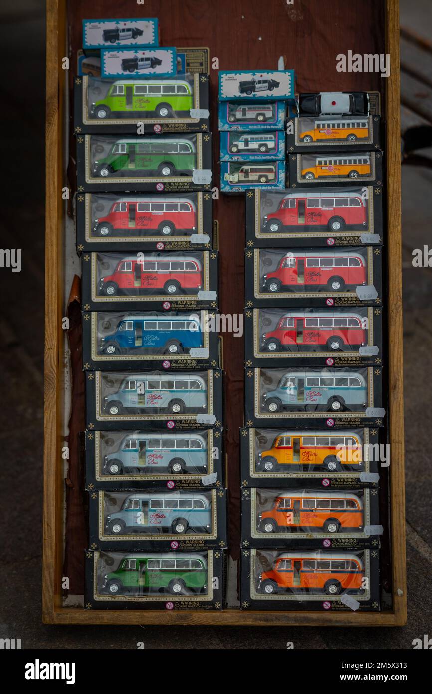 Typical oldtimer bus on malta as a souvenir or toy car in a cardboard packing for sale. Stock Photo