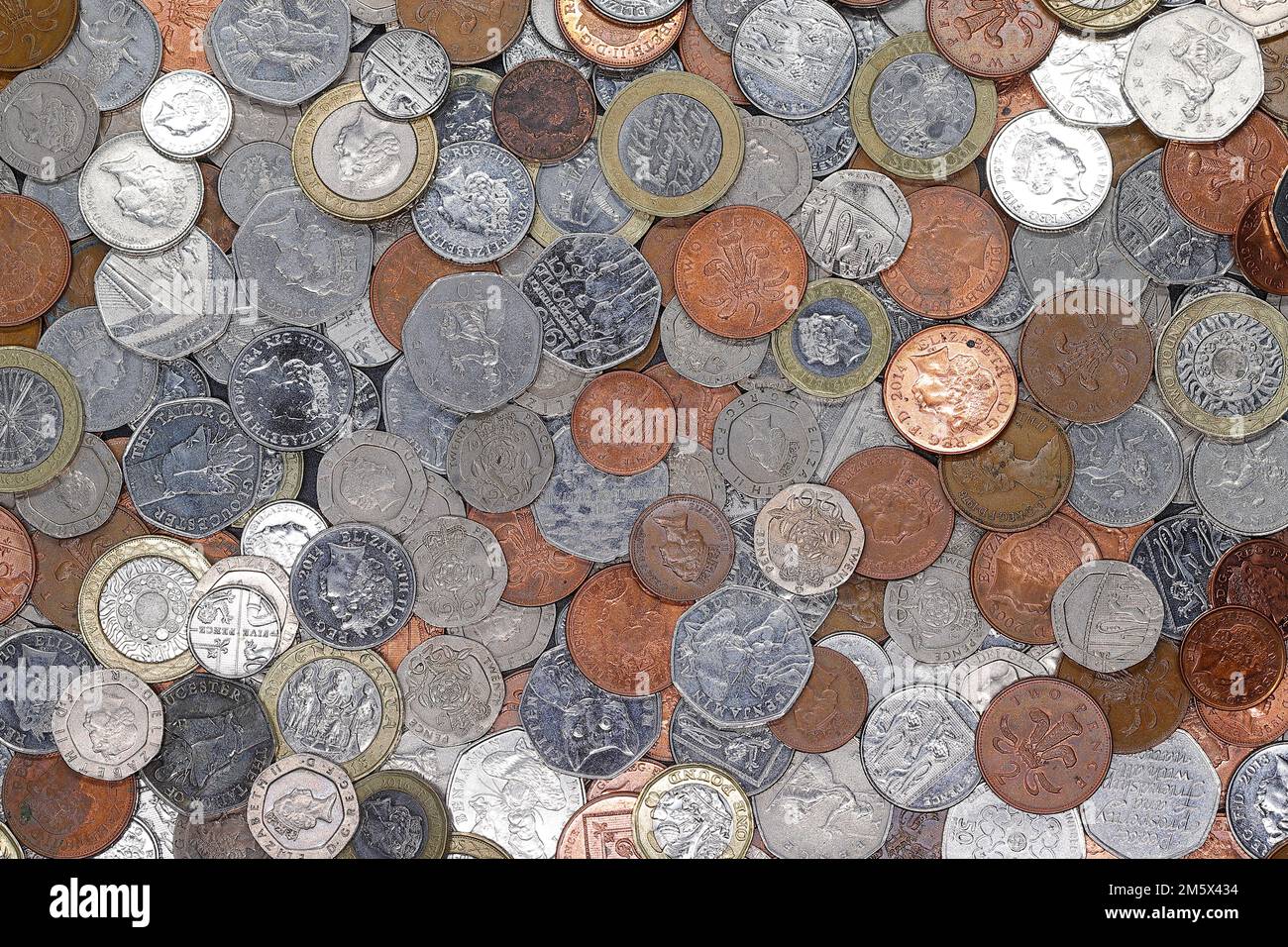 A pile of British coins including 1 pence, 2 pence, 5 pence, 10 pence ...