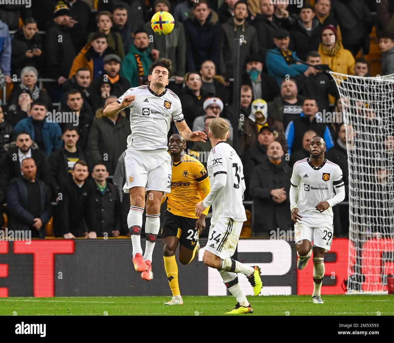 Harry Maguire #5 of Manchester United wins a clearing header during the 