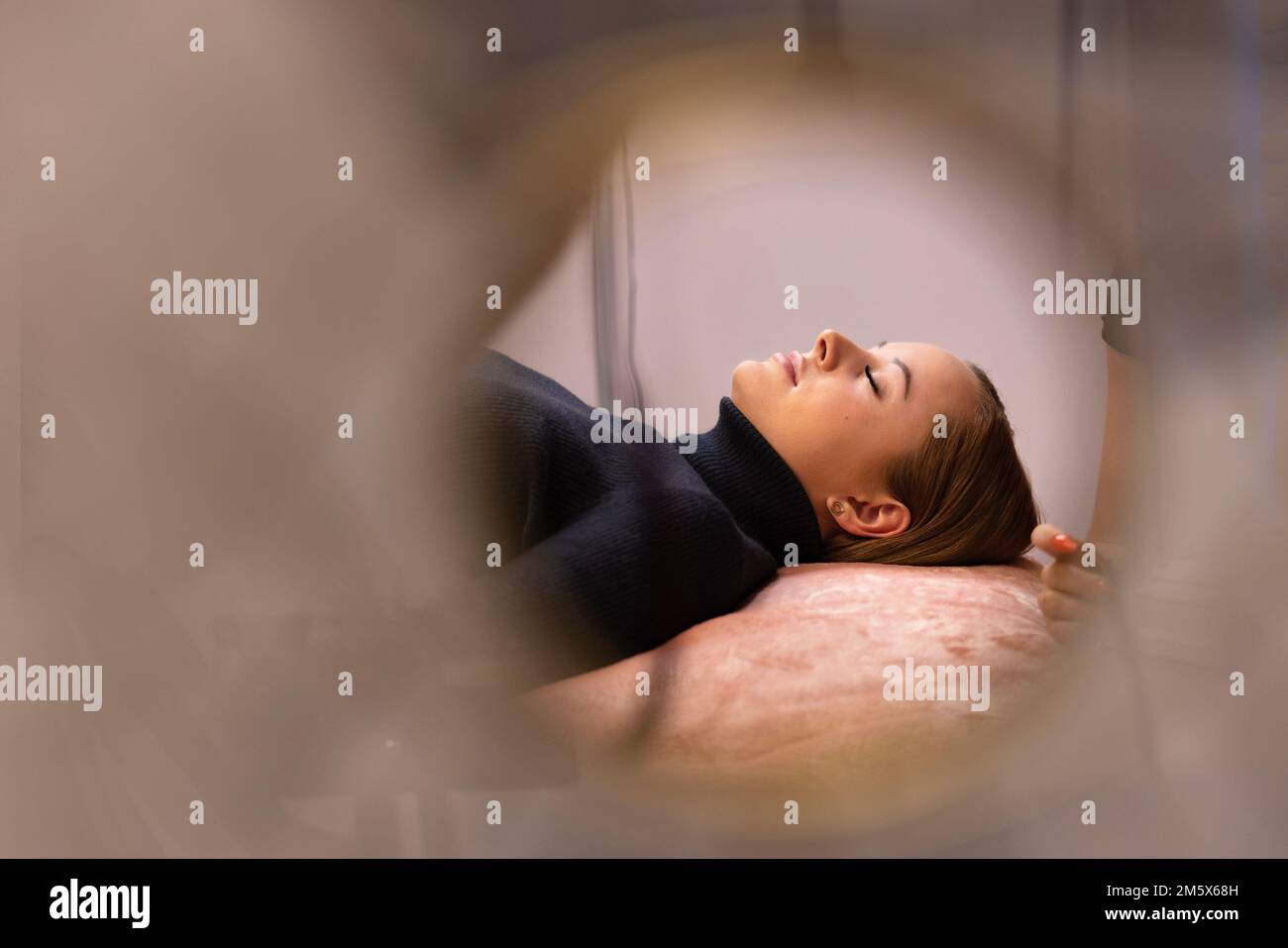 Beautiful Young Woman Lying On Bed At Beauty Spa Stock Photo