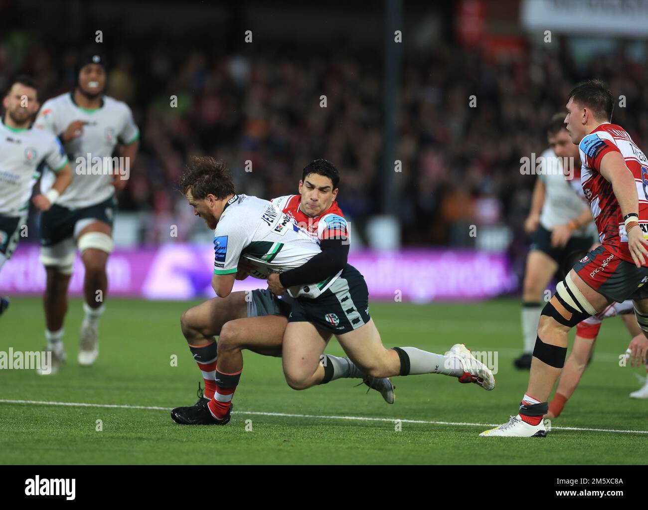 London Irish's Rory Jennings tackled by Gloucester Rugby's Santiago Carreras during the Gallagher Premiership match at Kingsholm Stadium, Gloucester. Picture date: Saturday December 31, 2022. Stock Photo