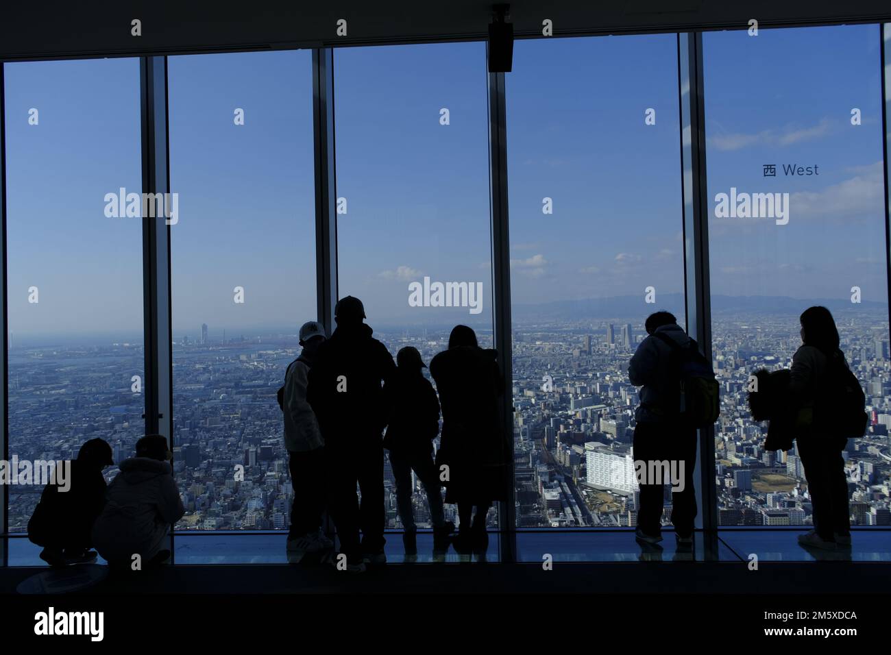 Osaka, Japan. 31st Dec, 2022. Visitors look at a panoramic view of the