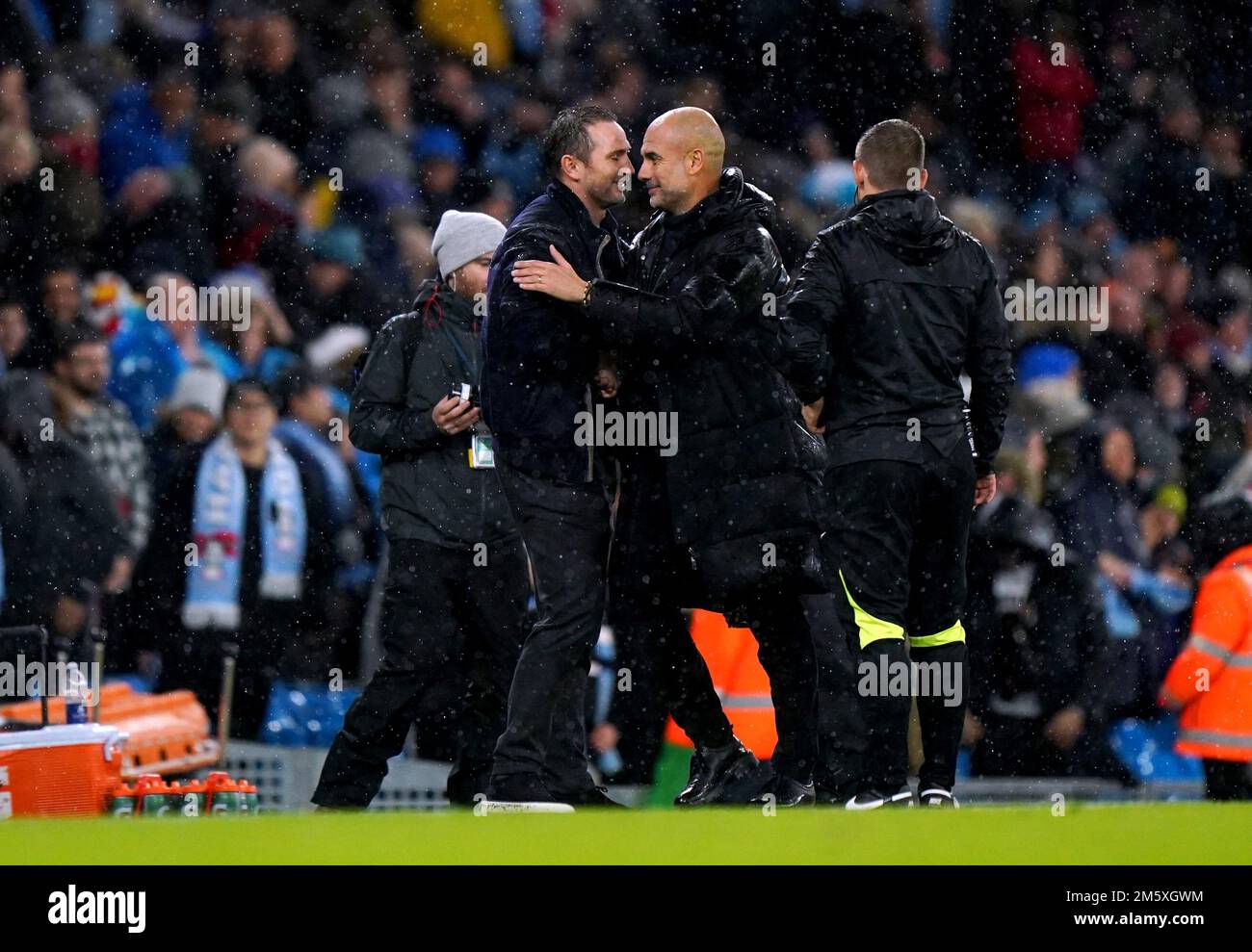Everton manager Frank Lampard (left) hugs Manchester City manager Pep Guardiola at the end of the Premier League match at the Etihad Stadium, Manchester. Picture date: Saturday December 31, 2022. Stock Photo