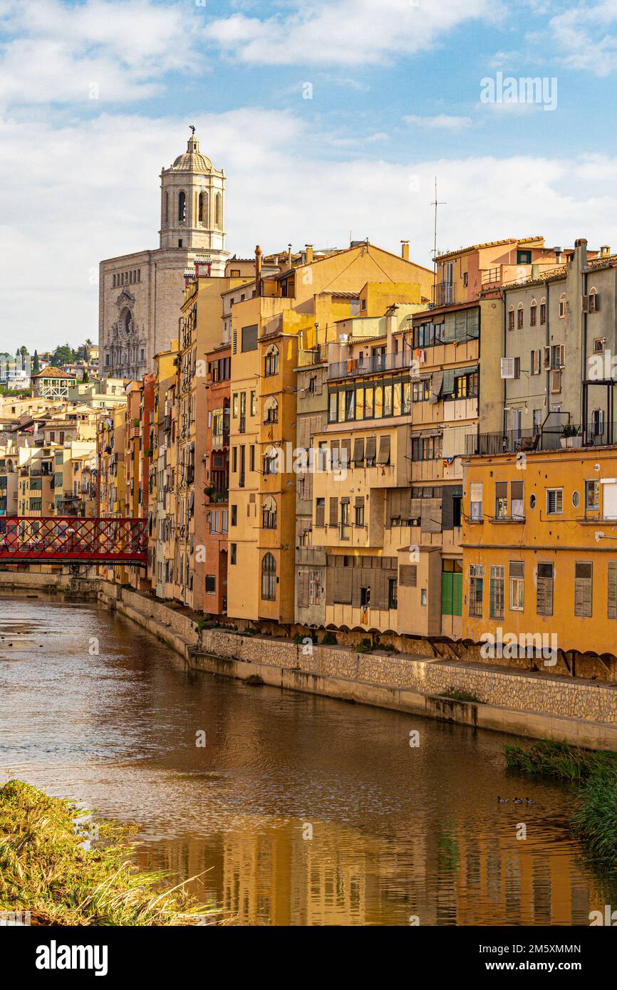 Looking down the river Onyar in the medieval Catalonian city of Girona with the Cathedral Santa Maria on the skyline Stock Photo