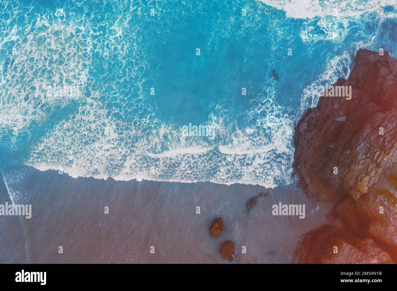 Top view of the beach with big brown stones Stock Photo