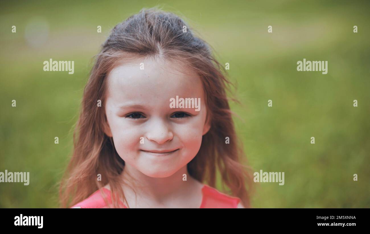 Portrait of a 6yearold girl in a park in the summer Stock Photo Alamy