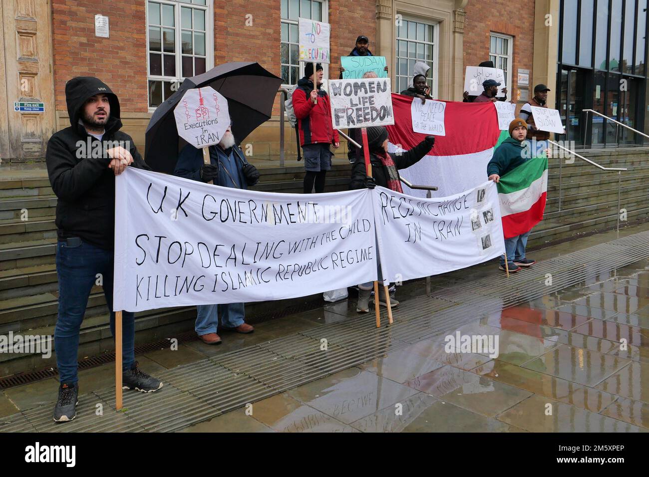 Iranian Protestors outside Derby City Council House on New Year's Eve 2022 protesting against the alleged murder by Iranian police of Mahsa Amini Stock Photo
