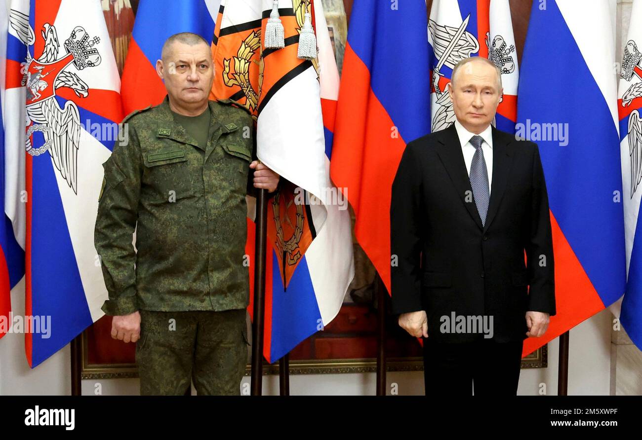 Rostov-on-Don, Russia. 31st Dec, 2022. Russian President Vladimir Putin presents soldiers with the 1st Donetsk Army Corps, 2nd Lugansk-Severodonetsk Army Corps, Donetsk Higher Combined Arms Command School with banners during a ceremony at the Southern Military District headquarters, December 31, 2022 in Rostov-on-Don, Russia. Putin presented awards and delivered his New Year address during the visit. Credit: Mikhail Klimentyev/Kremlin Pool/Alamy Live News Stock Photo