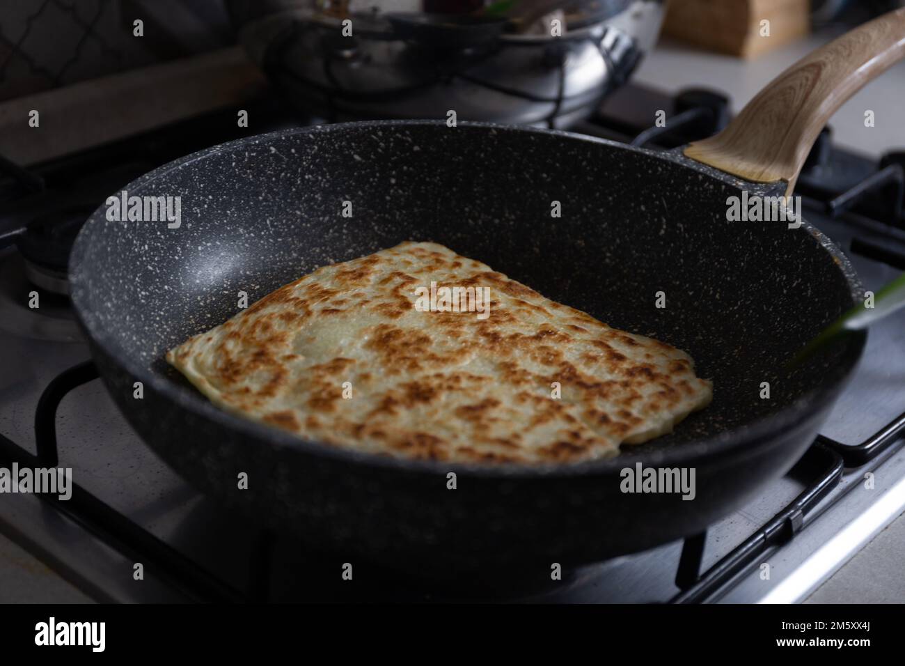 Moroccan Msemen flaky bread in the pan Stock Photo - Alamy