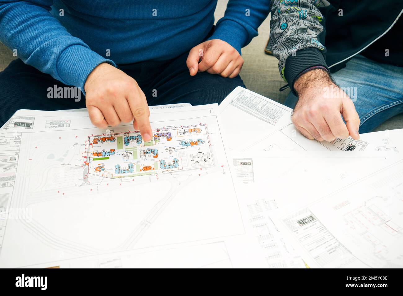 Partners working at building project on the office table Stock Photo