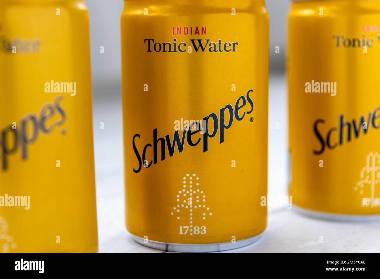 London. UK- 12.31.2022. Cans of Schweppes Indian Tonic Water in a row. Stock Photo