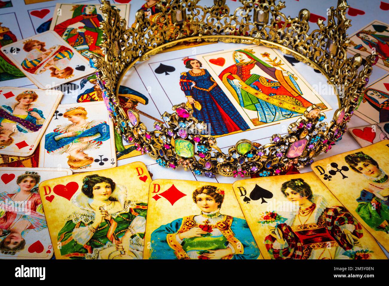 The Queens Crown and old playing cards of queens still life Stock Photo