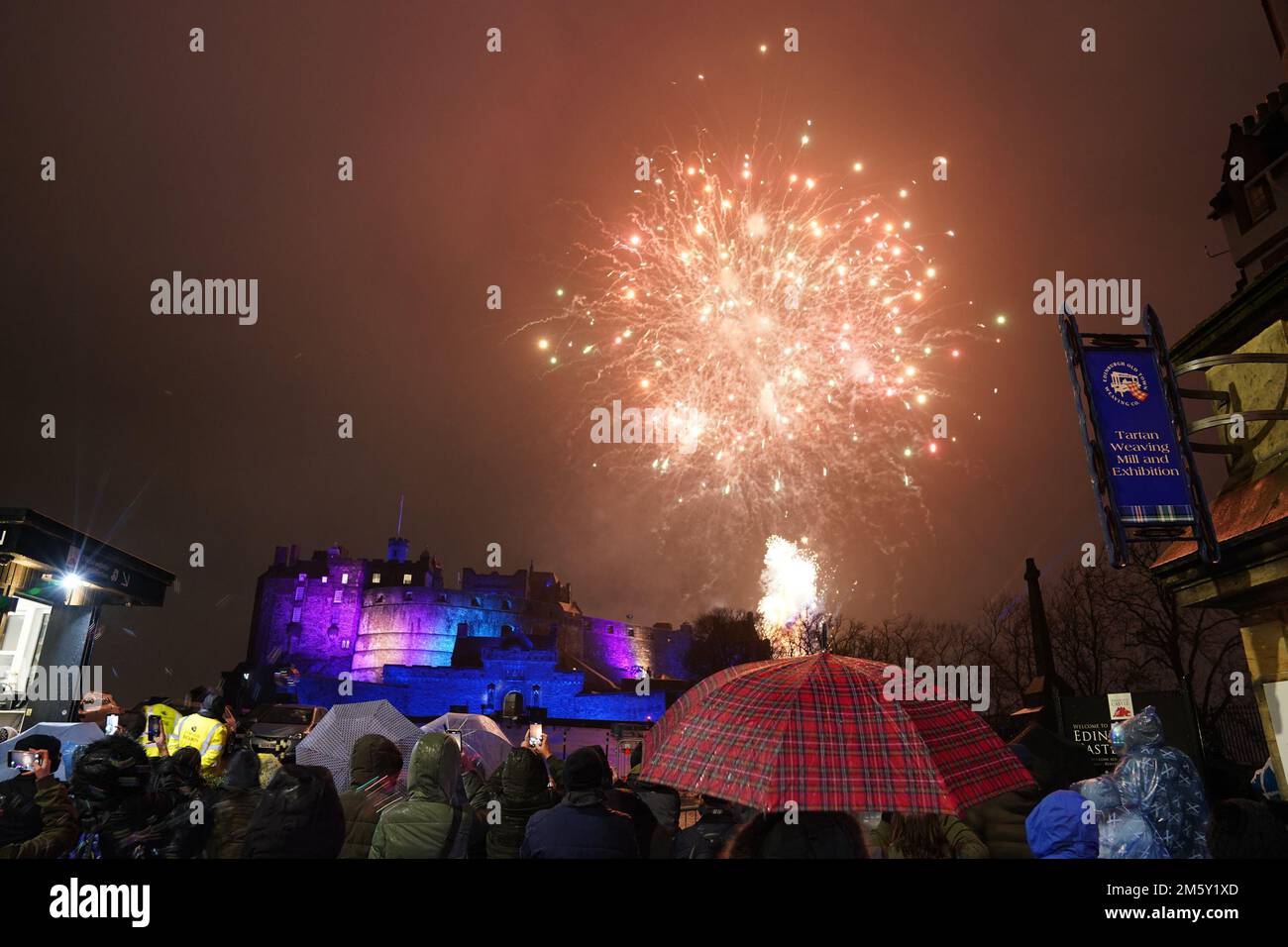 Revellers watch fireworks at Edinburgh Castle during the Hogmanay New