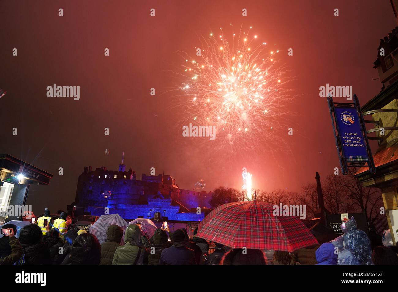 Revellers watch fireworks at Edinburgh Castle during the Hogmanay New