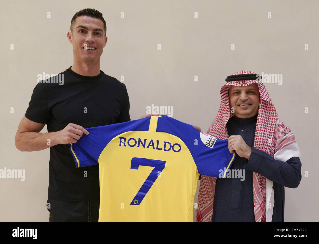 Madrid, Spain. 31st Dec, 2022. Cristiano Ronaldo (L) holds a team jersey of Saudi Arabian club Al Nassr with his name and No. 7 on it, in Madrid, Spain on Friday, December 30, 2022. Ronaldo has signed with the Saudi Arabian club in a deal worth a reported $200 million. Photo by Al Nassr FC/UPI Credit: UPI/Alamy Live News Stock Photo