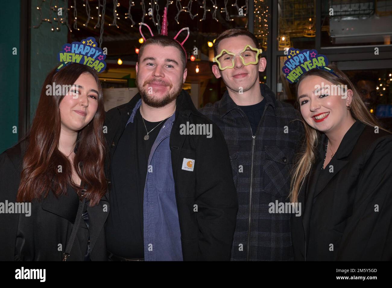 Wardwick, Derby, December 31st 2022. - Revellers enjoy themselves on NYE into 2023 in Derby city centre. Thousands of partygoers are expected to pack the bars and clubs as celebrations continued into the night. Credit: Ben Formby/Alamy Live News Stock Photo