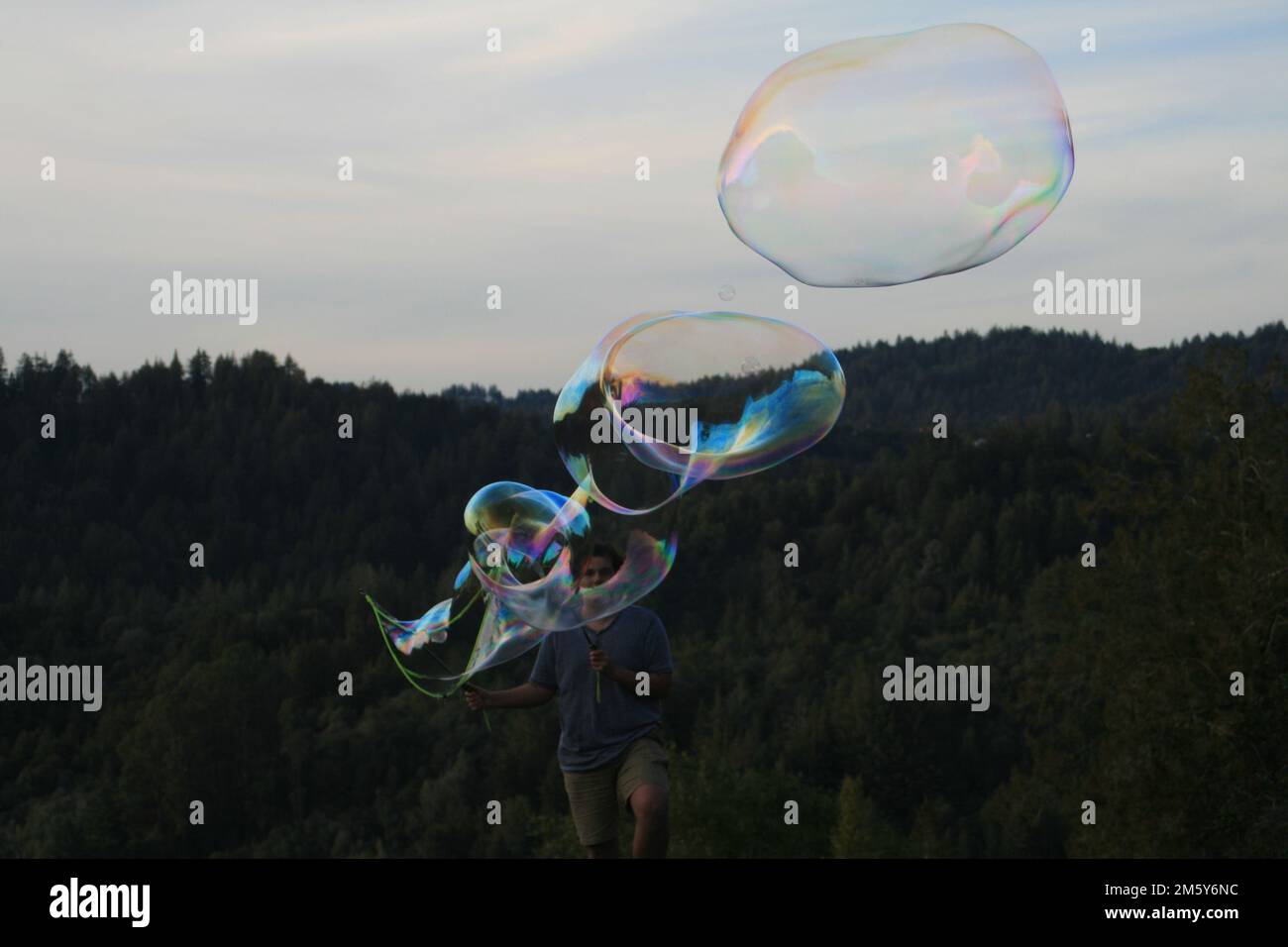 Giant Bubble Popping Stock Photo Alamy