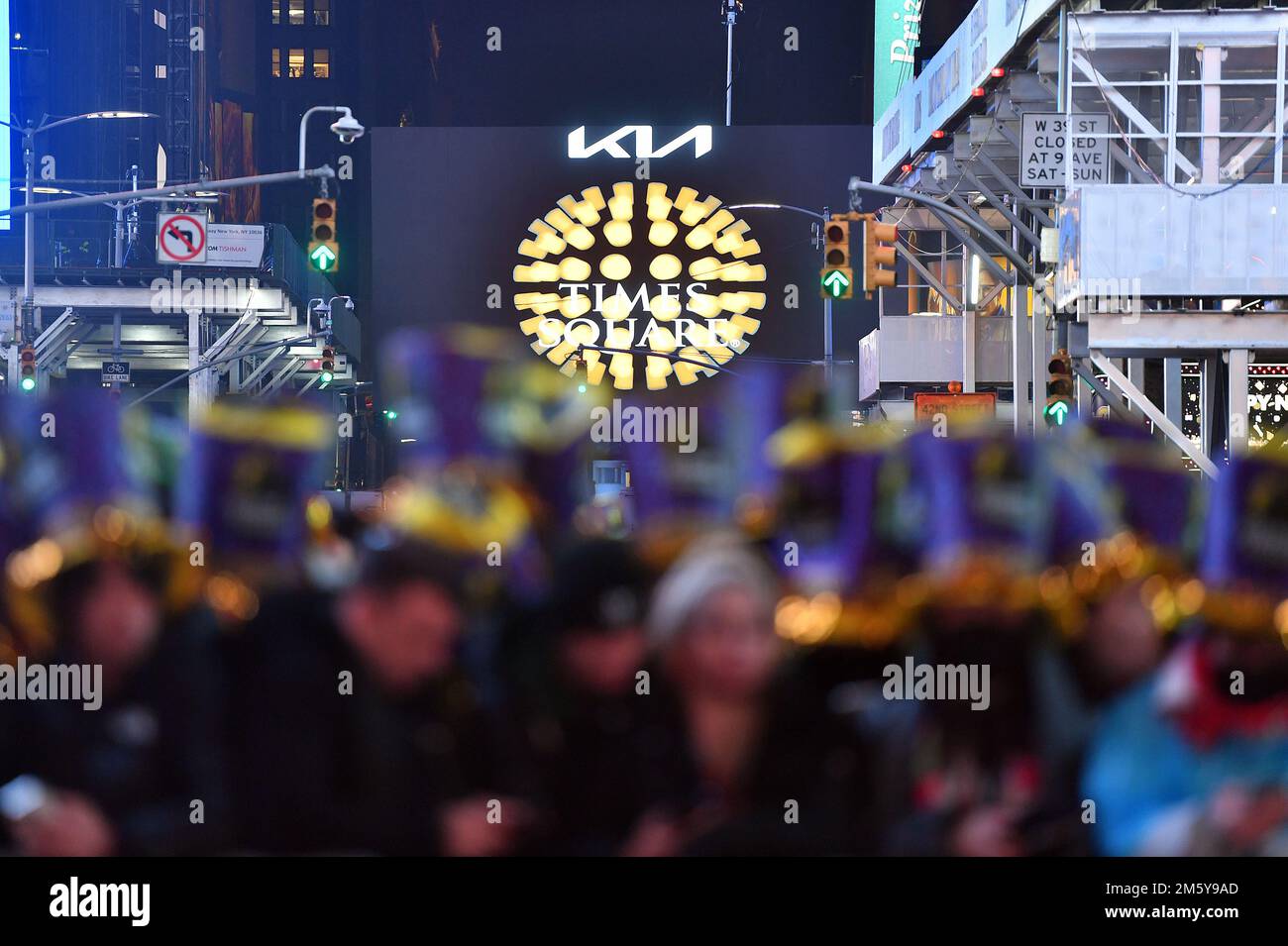 New York, USA. 31st Dec, 2022. Despite poor weather, revelers stand behind barricades to attend