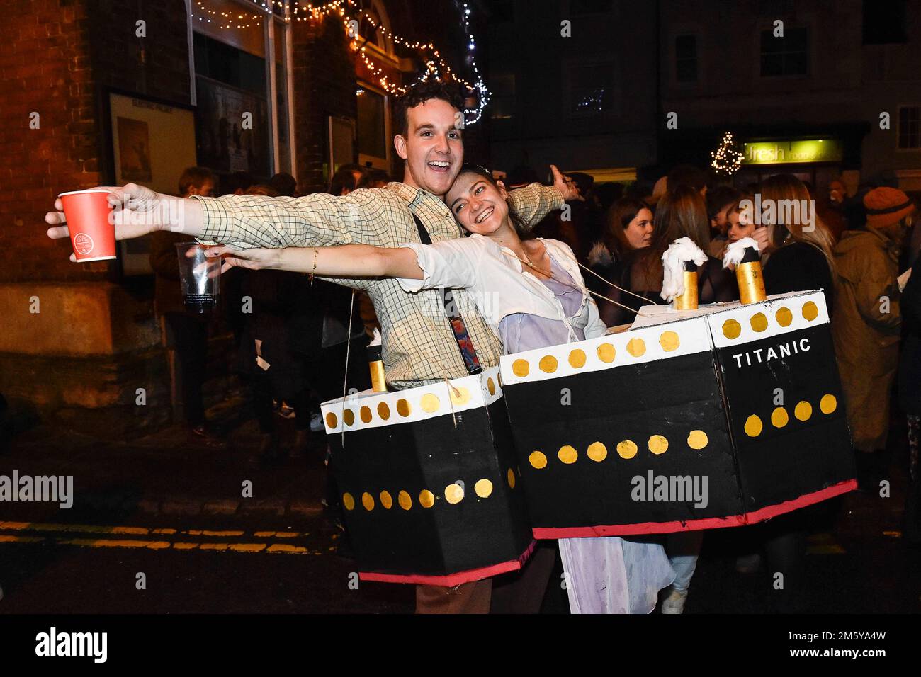 Bridport, Dorset, UK.  31st December 2022.  Revellers wearing Titanic fancy dress in Bucky Doo Square at Bridport in Dorset at midnight for the towns New Year celebrations.  Picture Credit: Graham Hunt/Alamy Live News Stock Photo
