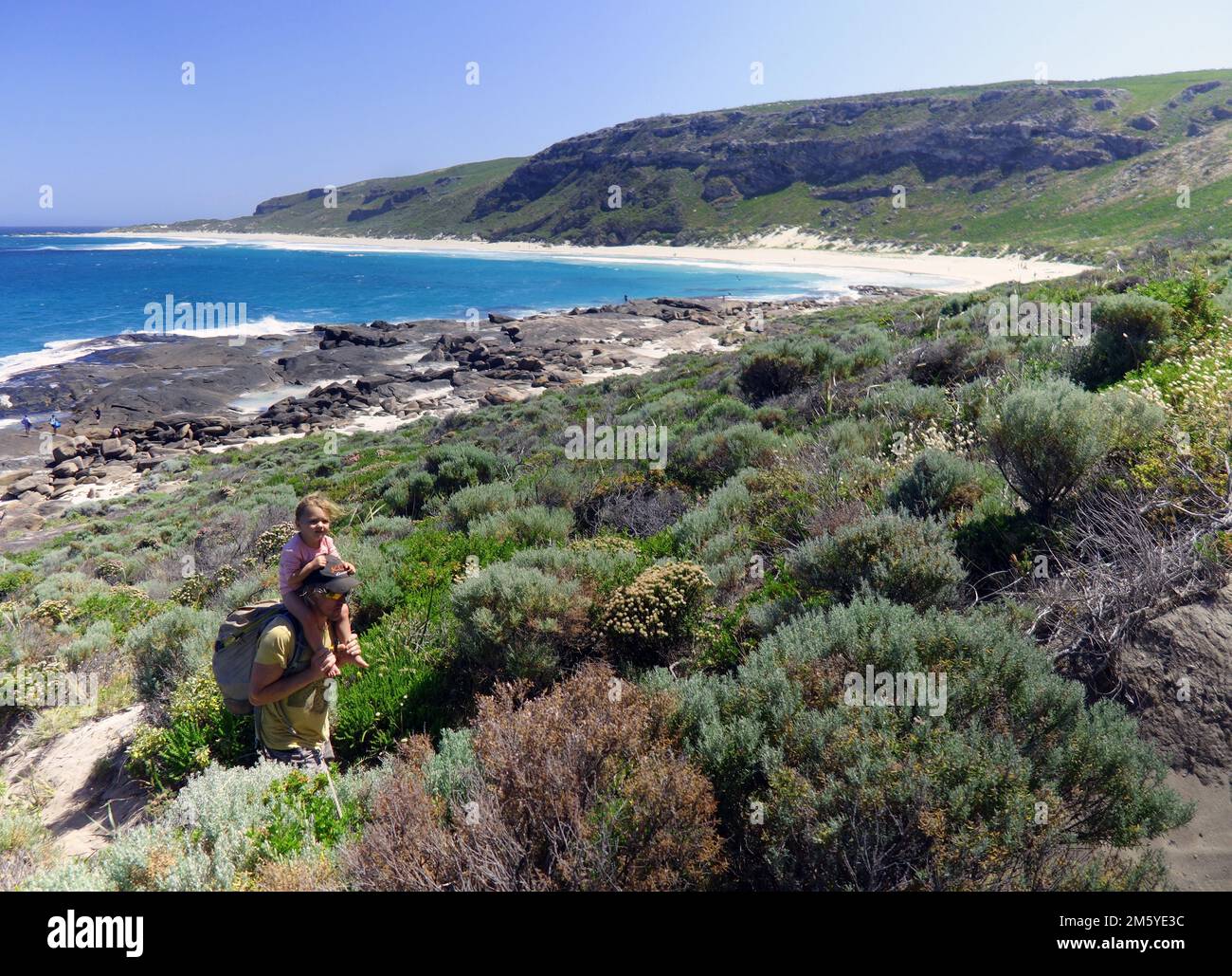 Father carrying daughter at Conto Springs, Cape to Cape Track, Leeuwin-Naturaliste National Park, Western Australia. No MR or PR Stock Photo