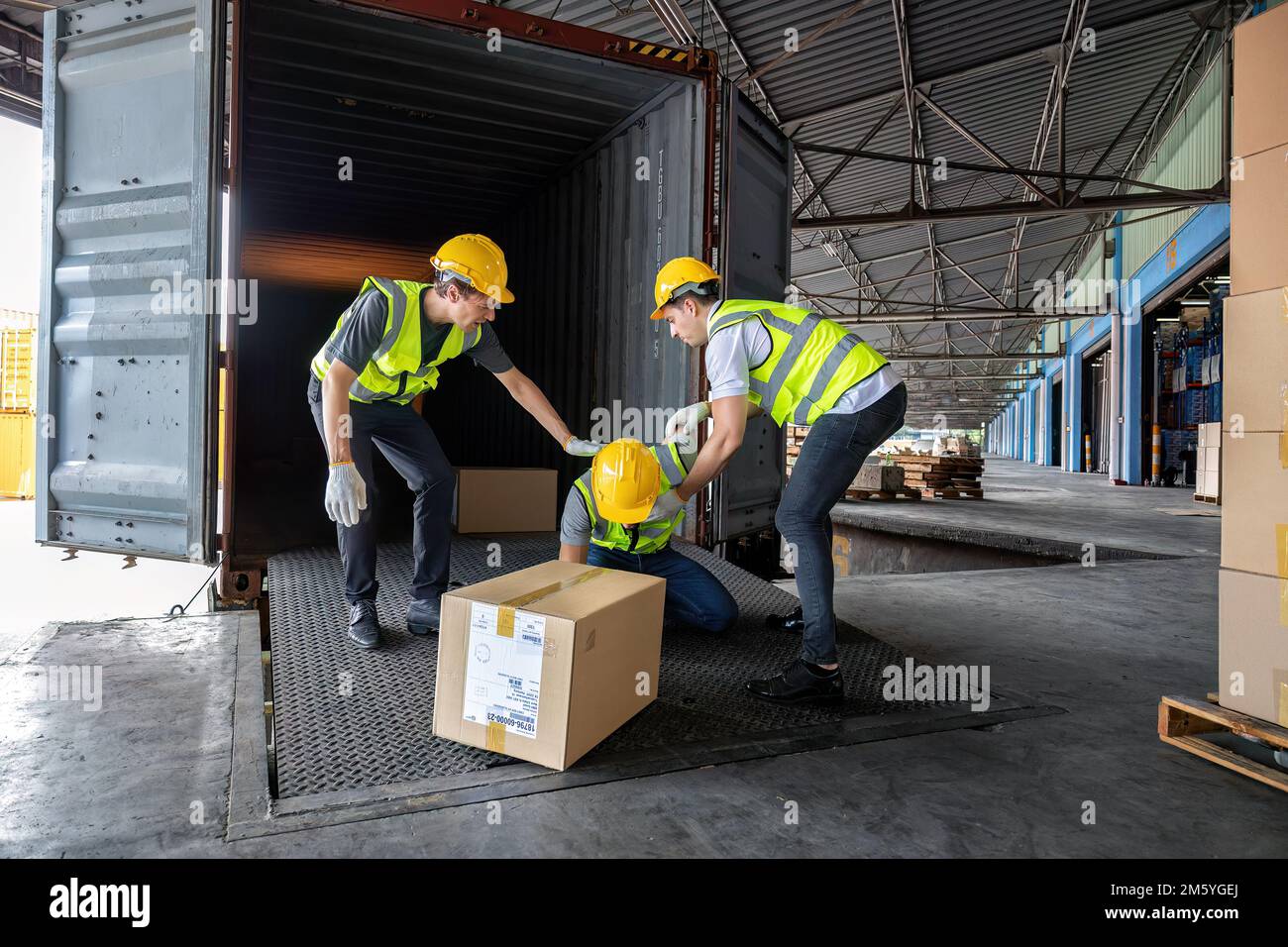 Worker carry carton box taken from 40 feet steel container got accident ...