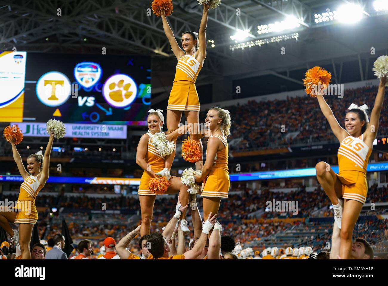 Miami Gardens, FL, USA. 30th Dec, 2022. The Tennessee cheerleaders perform a pyramid during the 2022 Capital One Orange Bowl football game between the Clemson Tigers and Tennessee Volunteers at Hard Rock Stadium in Miami Gardens, FL. Kyle Okita/CSM/Alamy Live News Stock Photo