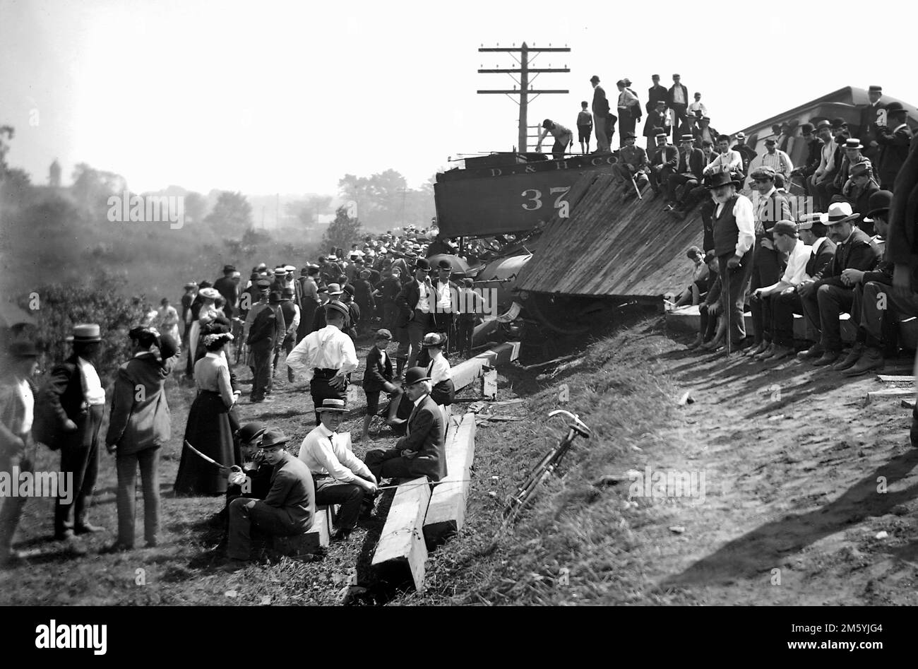 A large crowd mills about a Delaware & Hudson Railroad train wreck in New York State, ca. 1895. Stock Photo