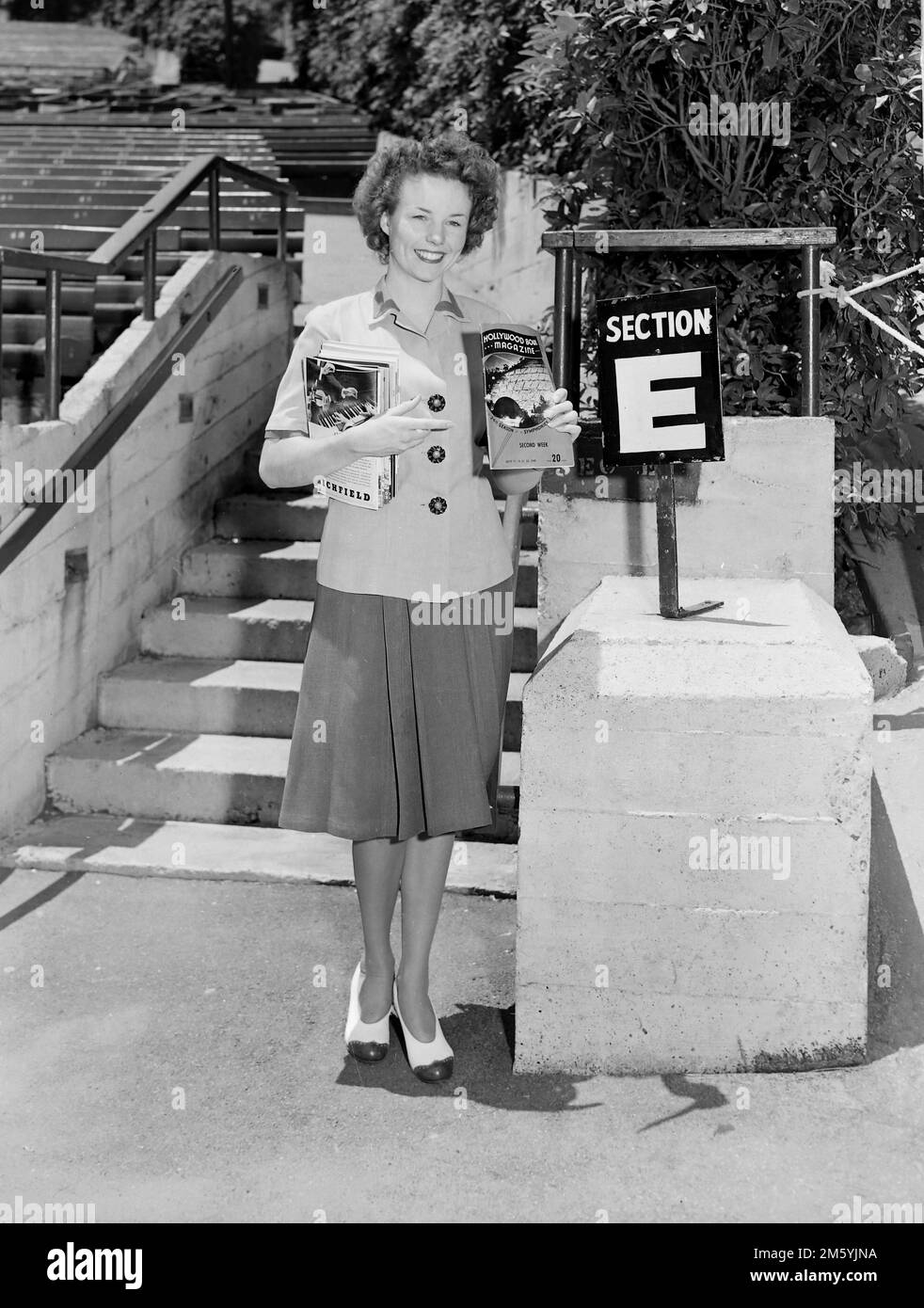 A usher is ready to help patrons at the Hollywood Bowl for a concert in 1945. Stock Photo