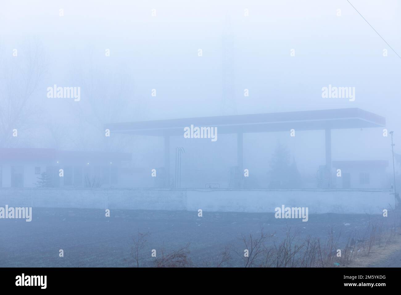 A petrol station in thick fog in Pakistan with zero visibility Stock Photo