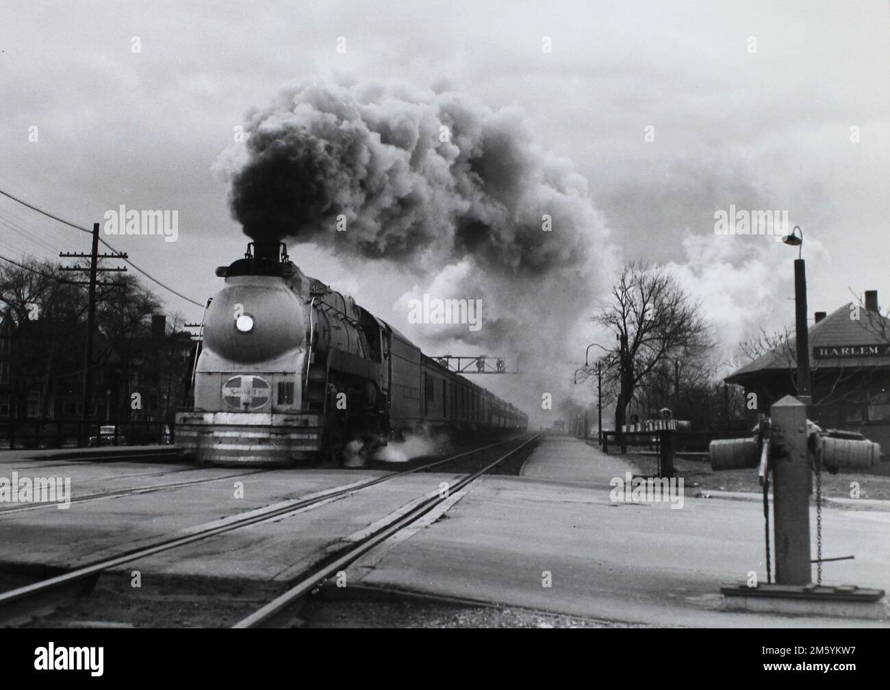 Santa Fe locomotive pulls a train through a grade cross at Harlem Ave. in Chicago, ca. 1940. Stock Photo
