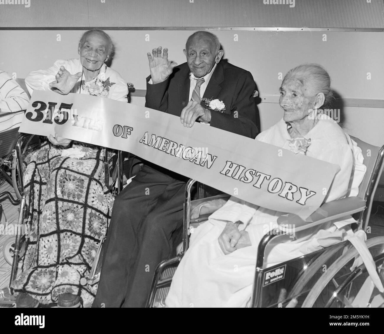 Senior citizens with a combined total of 315 years on earth pose in a California nursing home, ca. 1963. Stock Photo