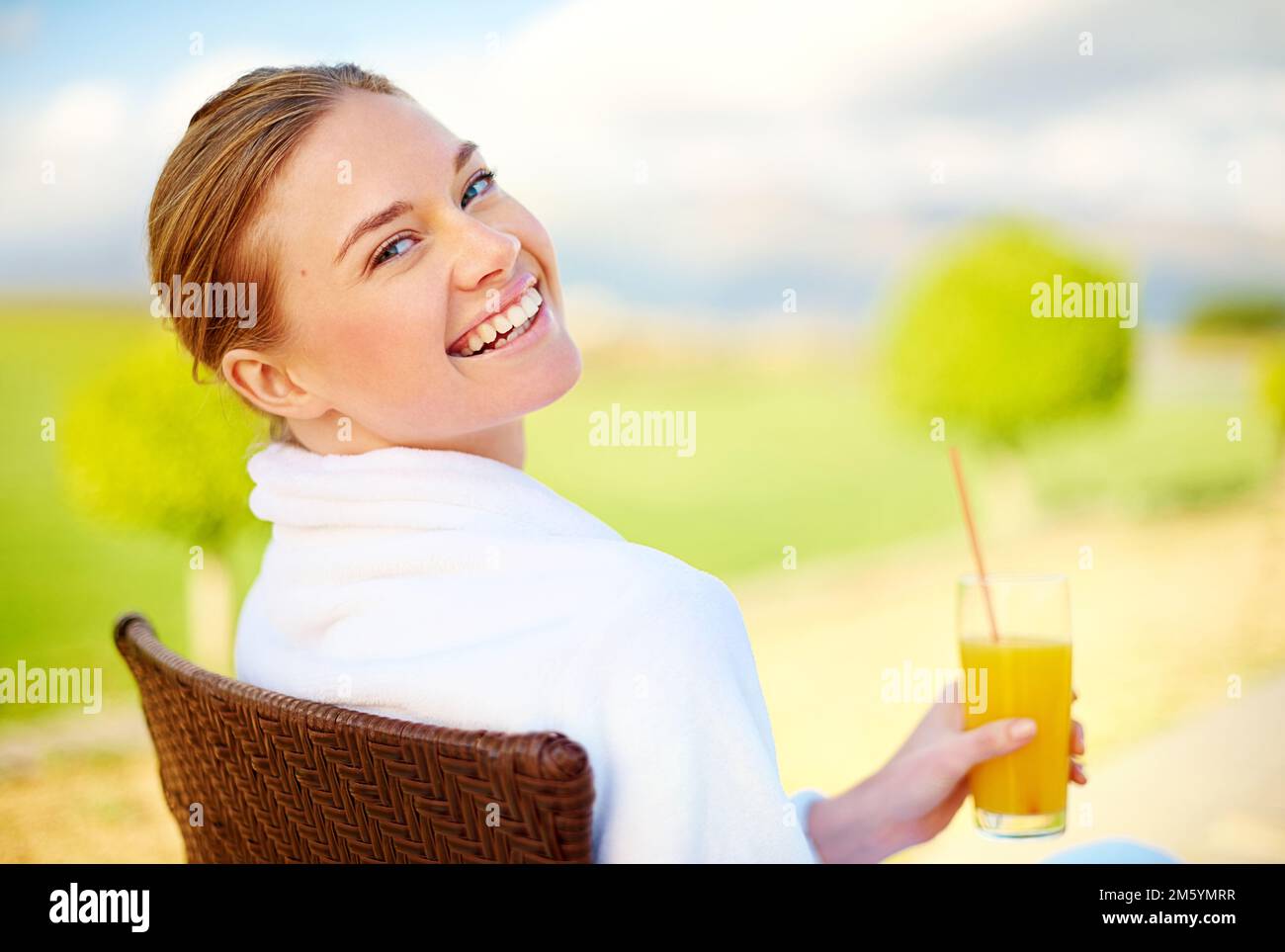 Treating myself to a weekend of wellness. Portrait of an attractive young woman enjoying a drink at a spa. Stock Photo
