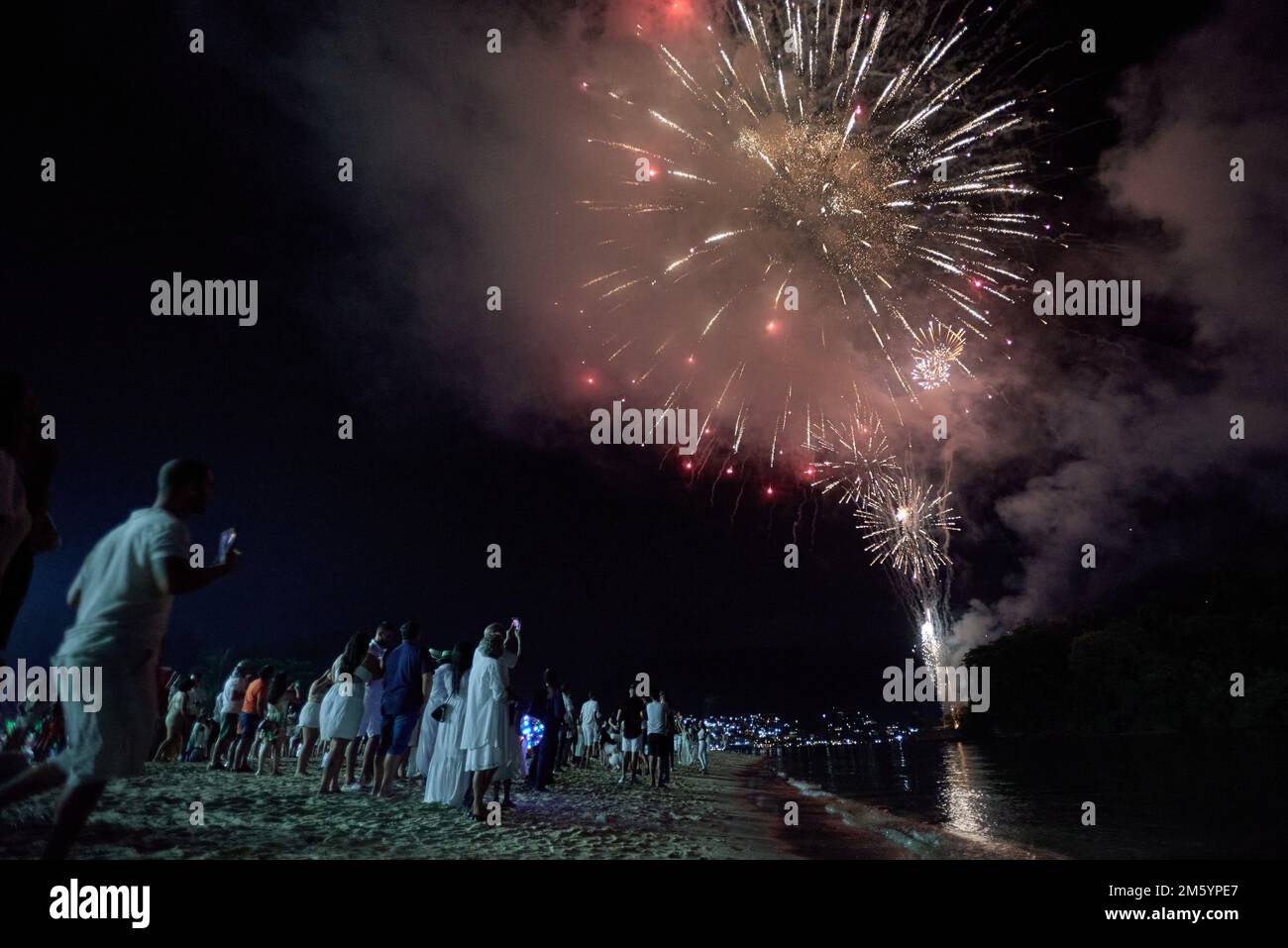 January 1, 2023, Angra dos Reis, Rio de Janeiro, Brazil: Fireworks color  the sky at Praia do Anil, in Angra dos Reis, on the southern coast of Rio  de Janeiro, Brazil, celebrating