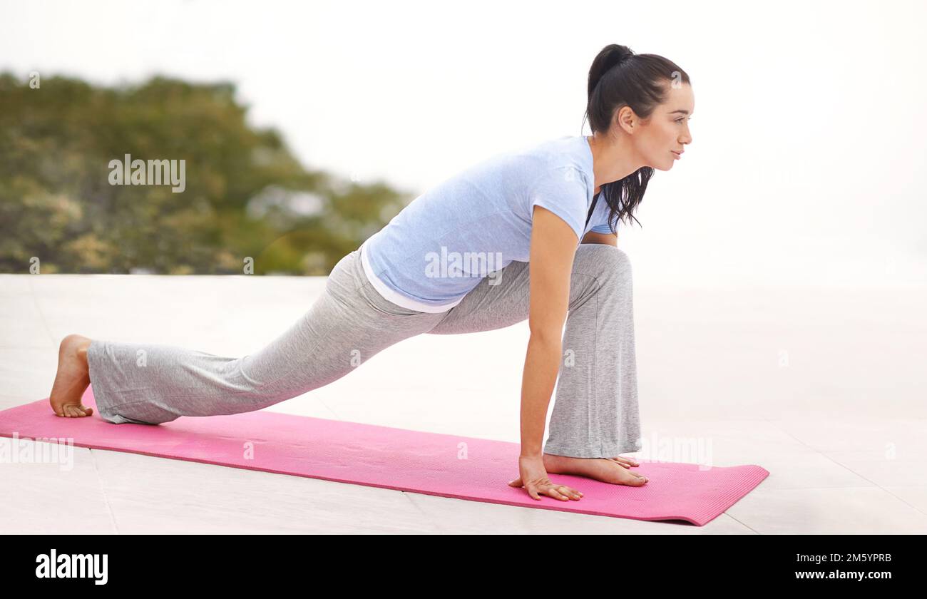 Woman kneeling outdoors hi-res stock photography and images - Alamy