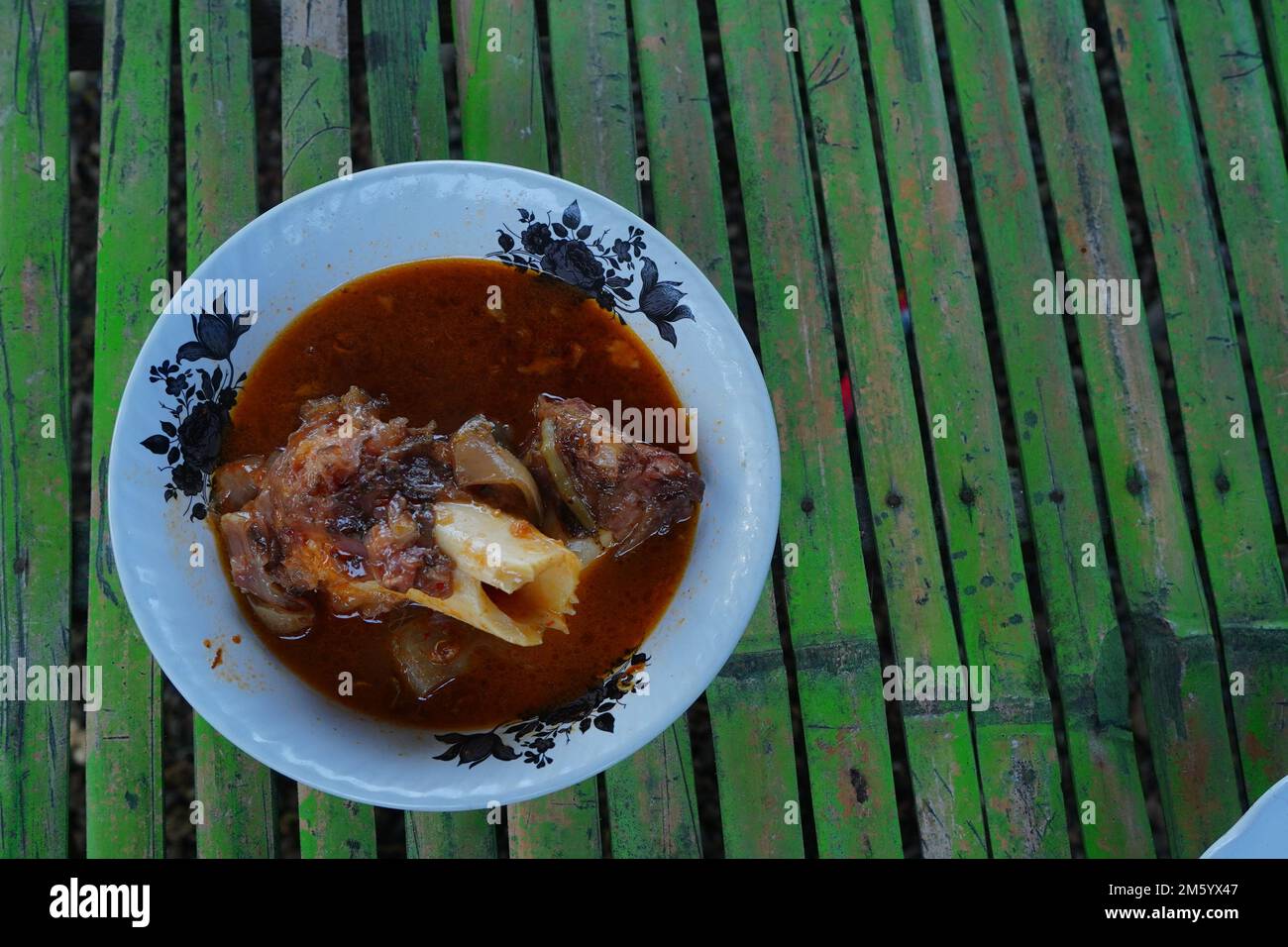 Spicy Foot cow soup is the Indonesian food especially in Madura Island Stock Photo