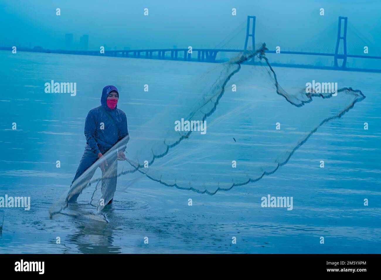 Young boy fishing in stream, using fishing net, low angle view Stock Photo  - Alamy