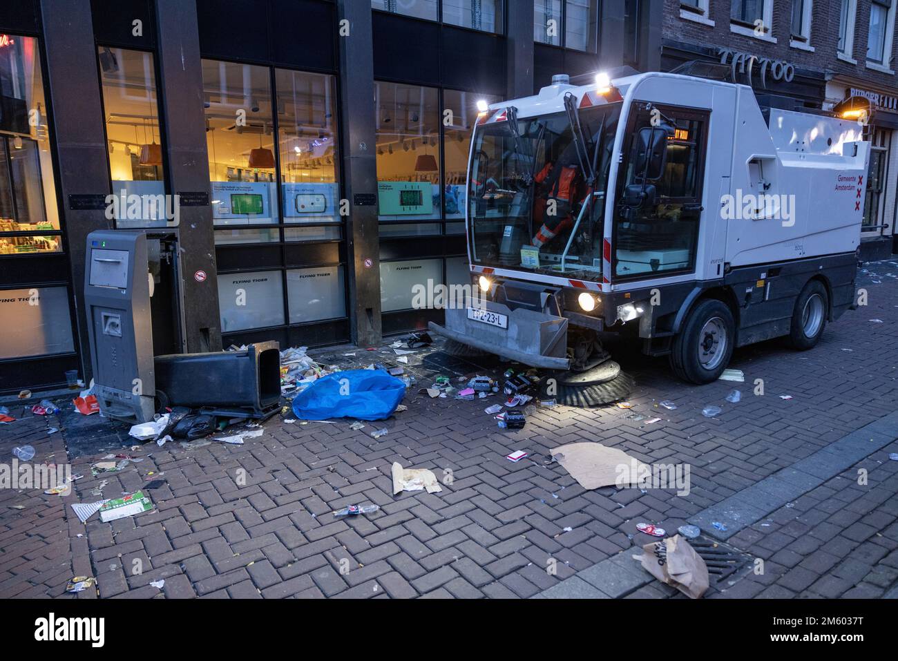 AMSTERDAM New Year's Eve mess on the Rembrandtplein. Cleaning crews