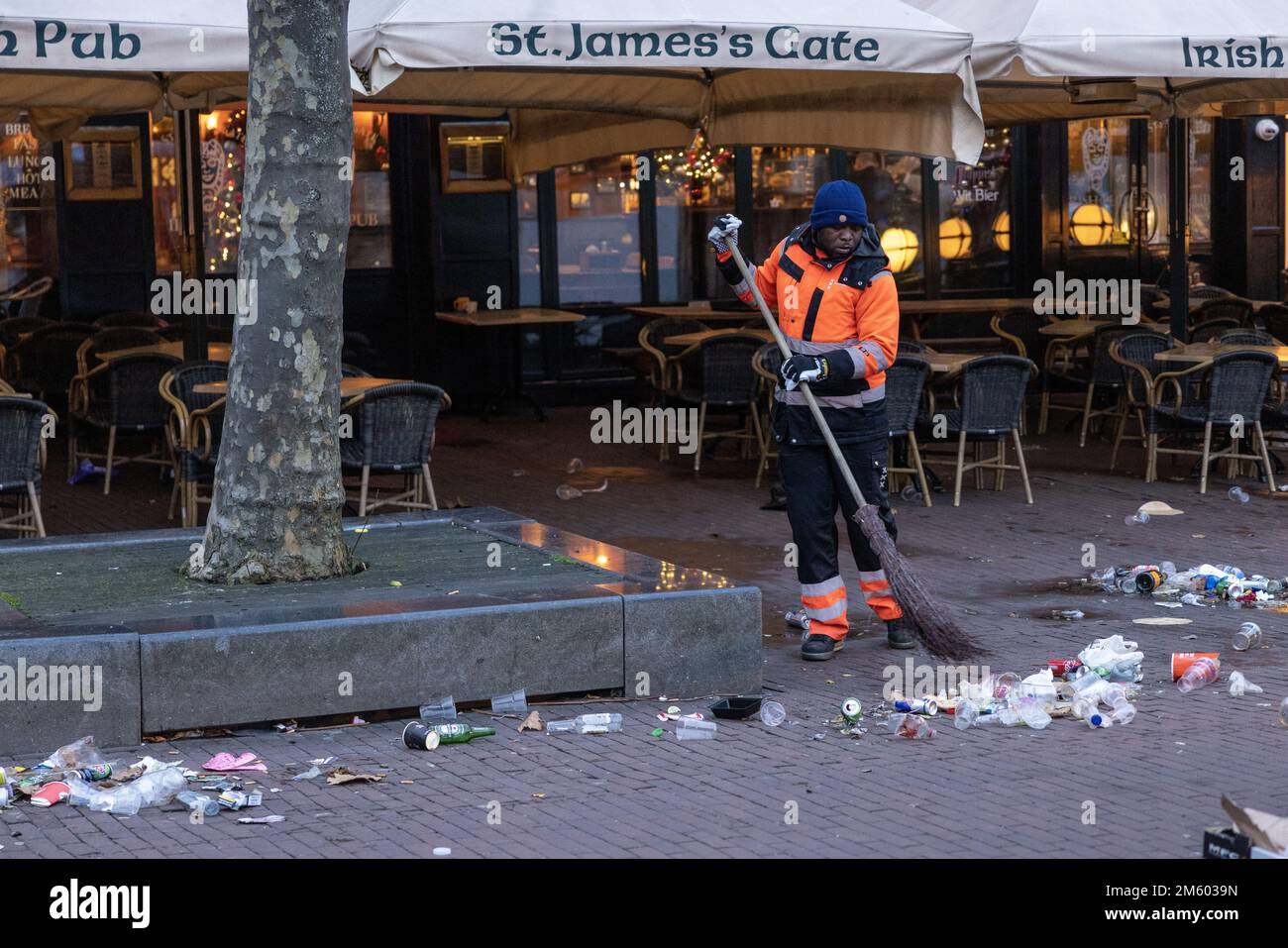 AMSTERDAM New Year's Eve mess on the Rembrandtplein. Cleaning crews