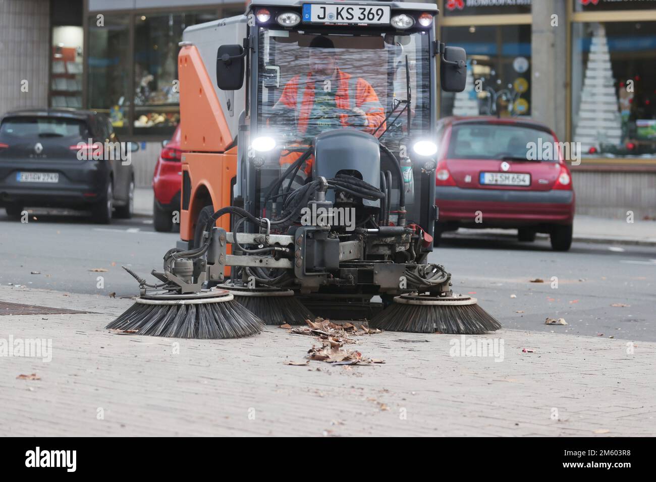 Jena, Germany. 01st Jan, 2023. A sweeper of the municipal municipal service removes remains of fireworks on the Eichplatz in the center. According to the regional police directorate, there was a high volume of operations on New Year's Eve. Credit: Bodo Schackow/dpa/Alamy Live News Stock Photo